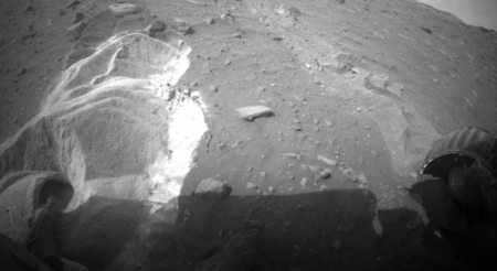 This picture shows the light-toned, disturbed soil where Spirit is currently stuck. The wheels spin, but just sink deeper in the soft sand.